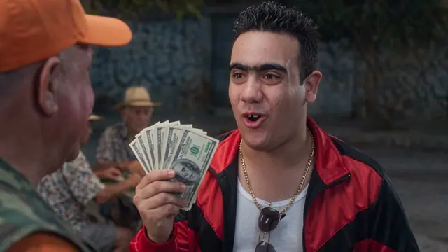 Pachi showing off a fan of dollar bills