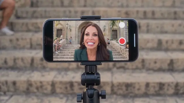 The mayor livestreaming on a phone on a tripod